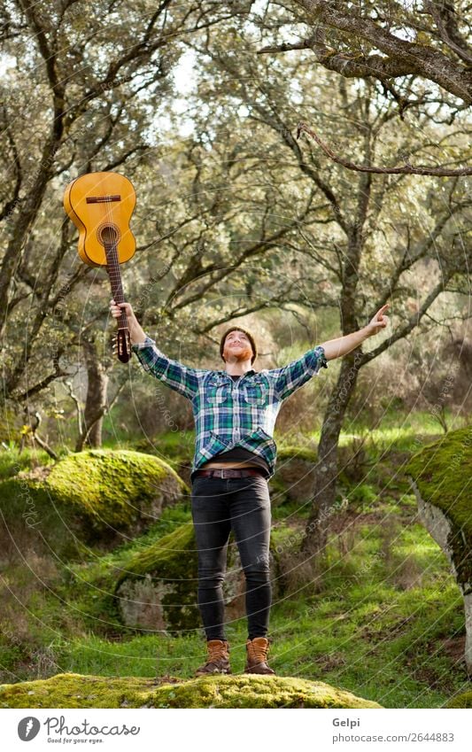 Happy hipster man with a guitar in the field Wellness Leisure and hobbies Playing Entertainment Music Success Human being Man Adults Musician Guitar Nature
