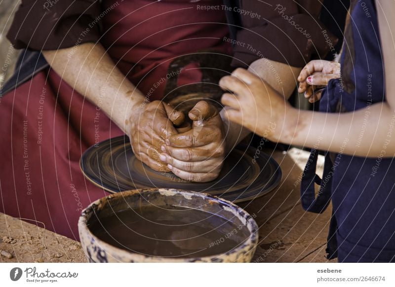Hands of a potter forming clay Bowl Pot Handicraft Child Work and employment Craft (trade) Human being Woman Adults Fingers Art Culture Touch Make Dirty Wet
