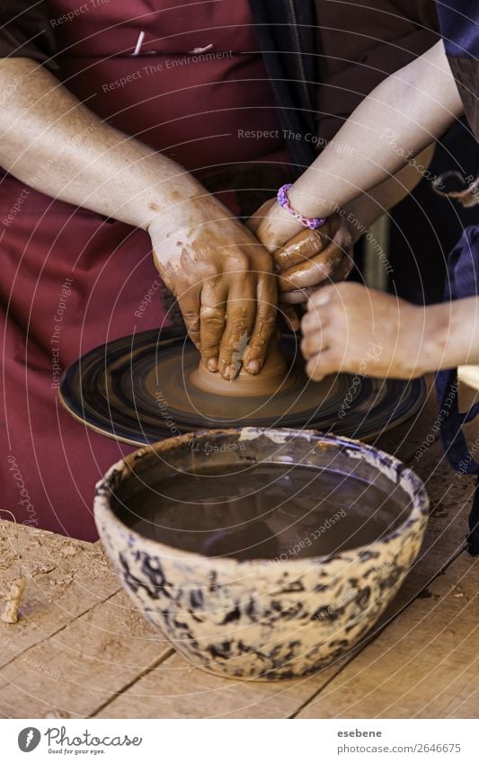 Hands of a potter forming clay Bowl Pot Handicraft Child Work and employment Craft (trade) Human being Woman Adults Fingers Art Culture Touch Make Dirty Wet