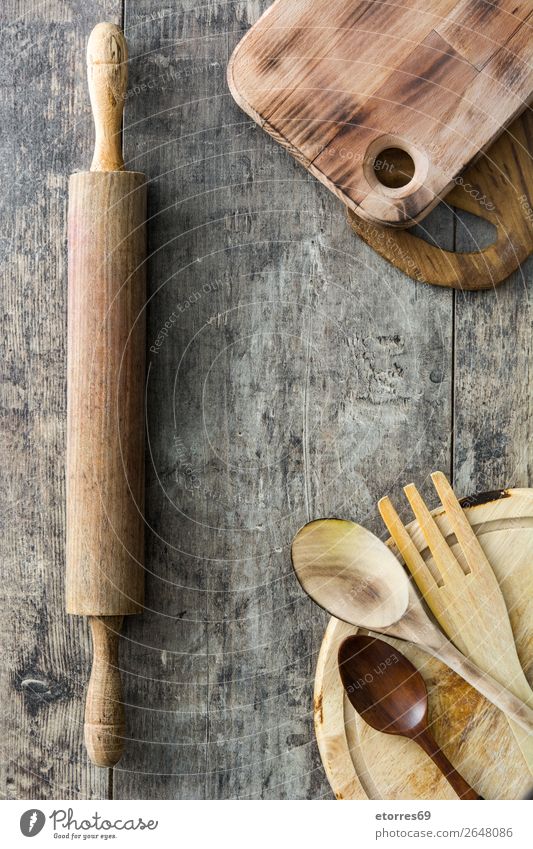 Cooking wooden utensils on wooden background Chopping board Crockery Ladle Wood Food Healthy Eating Food photograph Object photography Kitchen Equipment Surface