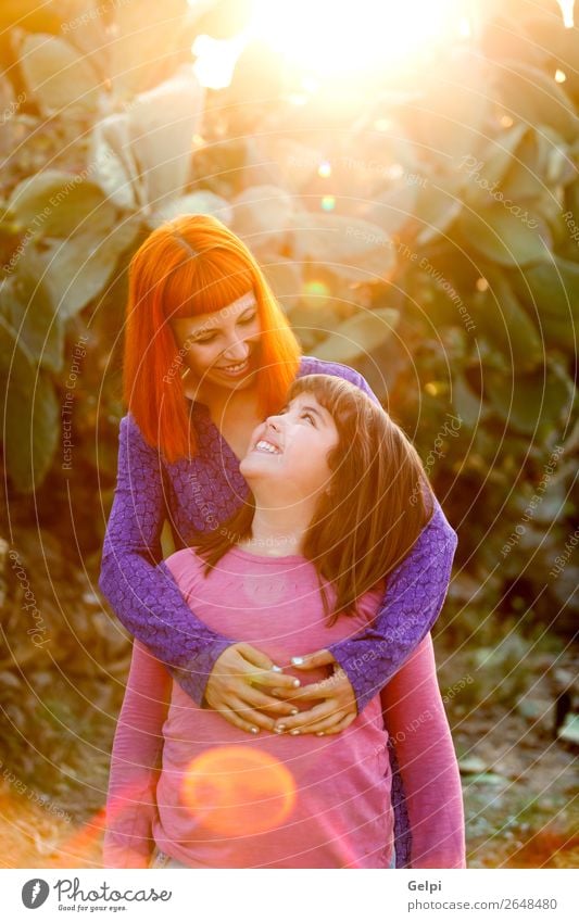 Red haired mom and her daughter Lifestyle Joy Happy Beautiful Playing Summer Parenting Child Woman Adults Parents Mother Family & Relations Infancy Park Street