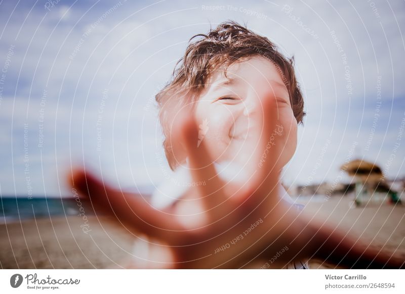 An smiling young boy in a sunny day Human being Masculine Baby Boy (child) Head 1 1 - 3 years Toddler Media Print media Clouds Beach Emotions Moody Enthusiasm