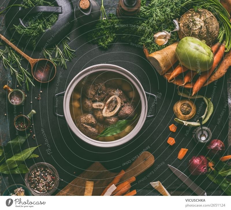 Boiled beef with bone in a saucepan Food Meat Vegetable Soup Stew Herbs and spices Nutrition Lunch Dinner Organic produce Diet Crockery Bowl Pot Knives Spoon