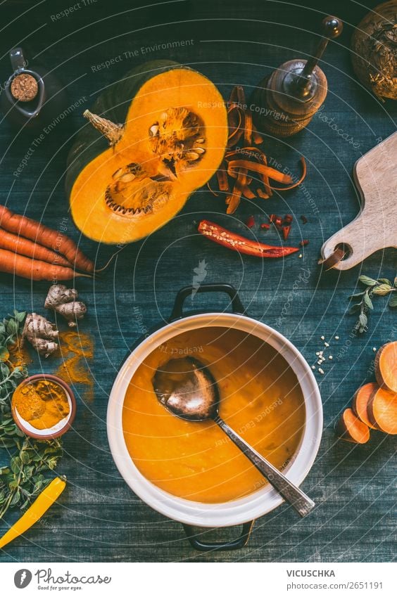Pumpkin soup in pot on kitchen table Food Vegetable Soup Stew Herbs and spices Nutrition Lunch Dinner Organic produce Vegetarian diet Diet Crockery Pot Spoon
