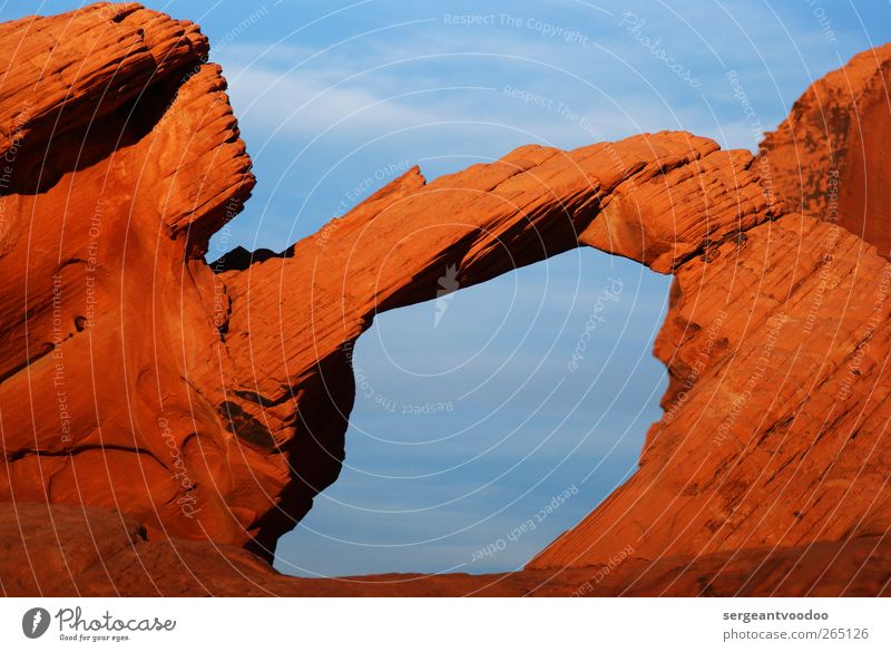Valley of fire - Arch Far-off places Freedom Nature Landscape Sky Rock Mountain Rock arch Canyon Esthetic Exceptional Fantastic Firm Gigantic Natural Blue Brown