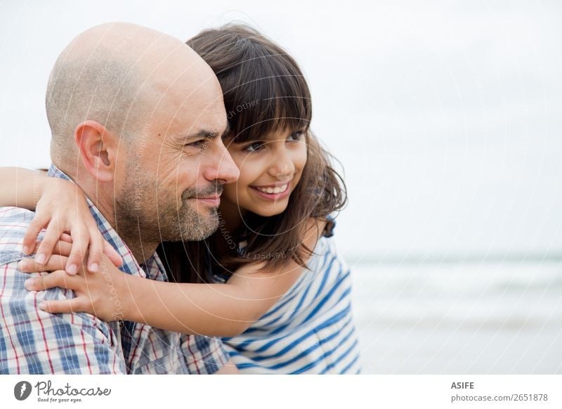 Father and daughter looking ahead Joy Happy Beautiful Beach Ocean Child Parents Adults Family & Relations Clouds Bald or shaved head Smiling Laughter Love