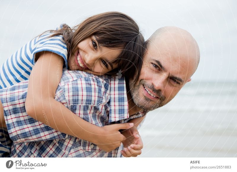 Beautiful father and daughter portrait Joy Happy Beach Ocean Child Parents Adults Father Family & Relations Clouds Bald or shaved head Smiling Laughter Love