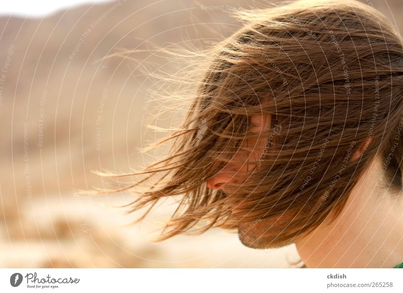 Man's long hair blowing in the wind - a Royalty Free Stock Photo from  Photocase