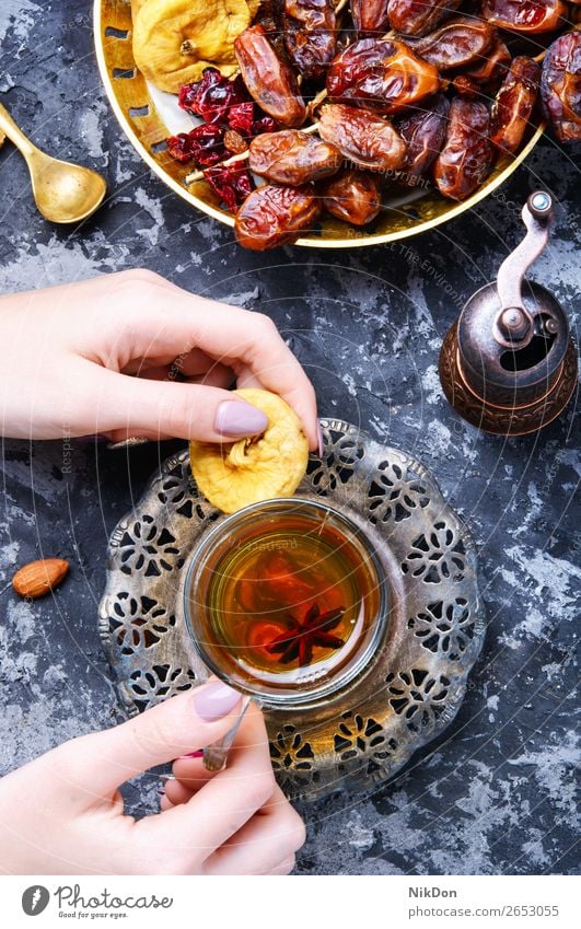 Cup of Turkish tea oriental hand drink fig fruits cup healthy teapot east hot beverage chinese asian herb table eastern arabic turkish relaxation arabian exotic
