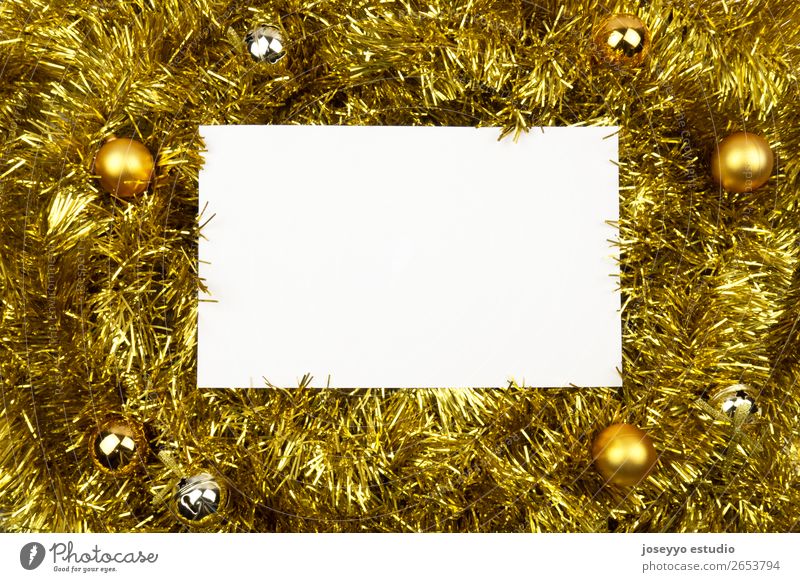 White card with copy space on golden tinsel. Design Happy Winter Decoration Feasts & Celebrations New Year's Eve String Simple Above Gold Creativity background