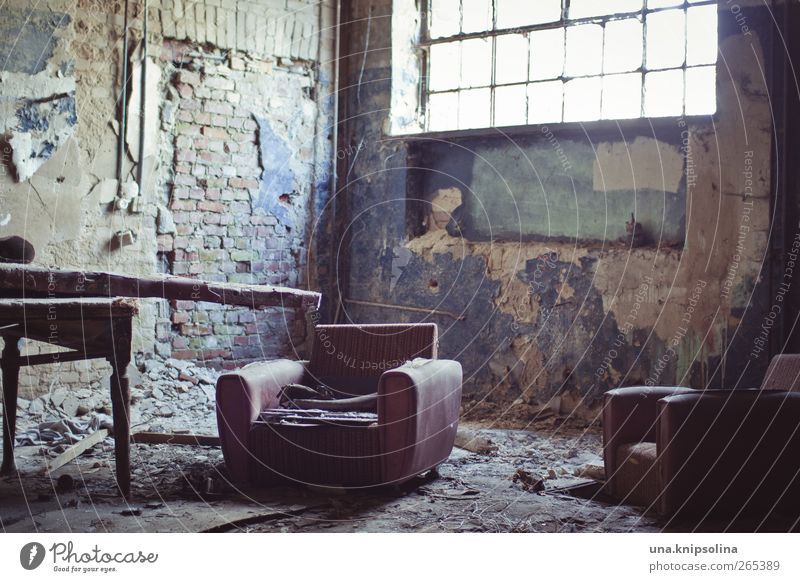 seating furniture Furniture Armchair Table Room Ruin Wall (barrier) Wall (building) Window Old Dirty Broken Chaos Decline Past Destruction Derelict Colour photo