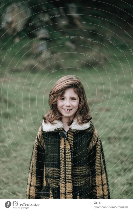 Beautiful girl with coat Joy Happy Face Winter Garden Child Human being Toddler Woman Adults Family & Relations Infancy Nature Autumn Warmth Grass Park Fashion