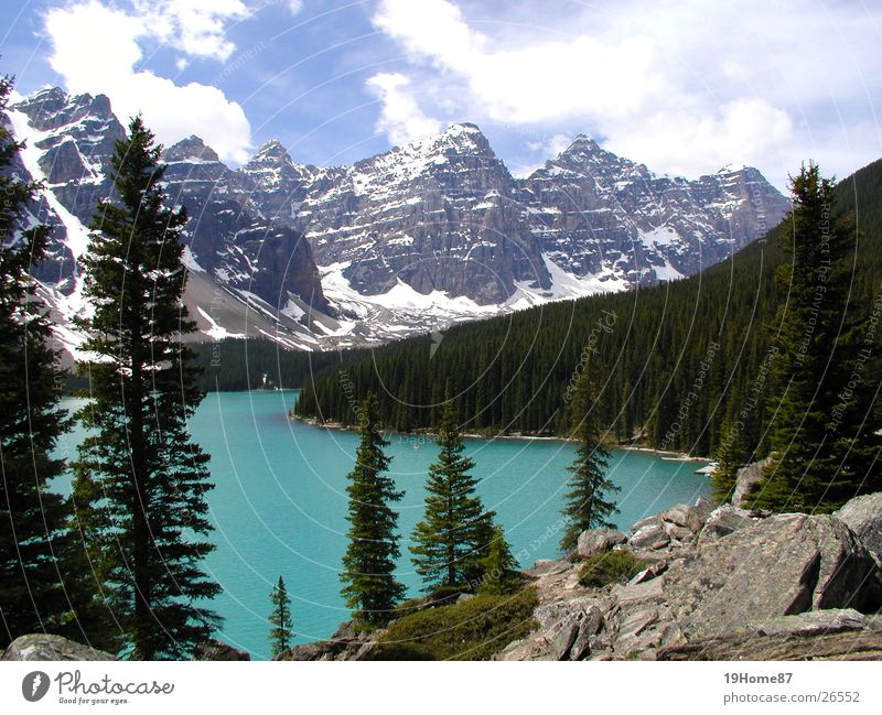 Moraine Lake, Canada Tree Clouds Coniferous trees Romance Relaxation Loneliness National Park Mountain Nature Fog Landscape moraine Blue Calm Tall rocky