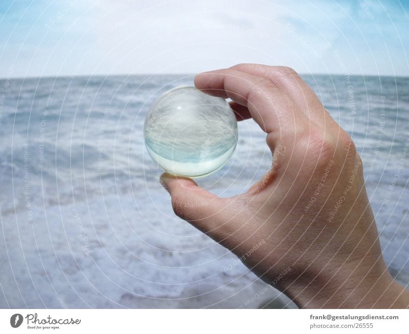 sea ball Hand Ocean Marble Reflection Surf Future Planning Abstract Beach Leisure and hobbies Trust Coast Sphere Water Phenomenon