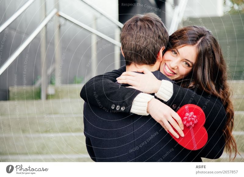 Valentines couple in love Joy Happy Beautiful Winter Feasts & Celebrations Valentine's Day Woman Adults Man Couple Hand Autumn Coat Heart Kissing Smiling Love