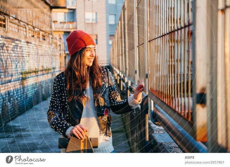 Skater woman at sunset Lifestyle Style Joy Happy Beautiful Leisure and hobbies Winter Sports Woman Adults Youth (Young adults) Culture Autumn Street Fashion Hat