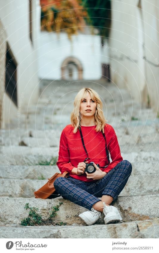 Woman taking photographs with an old camera in a beautiful city. Lifestyle Style Happy Beautiful Hair and hairstyles Leisure and hobbies Vacation & Travel