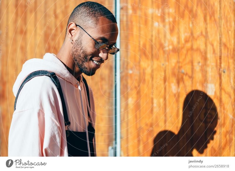 Young black man wearing casual clothes and sunglasses outdoors Lifestyle Happy Beautiful Human being Masculine Young man Youth (Young adults) Man Adults 1