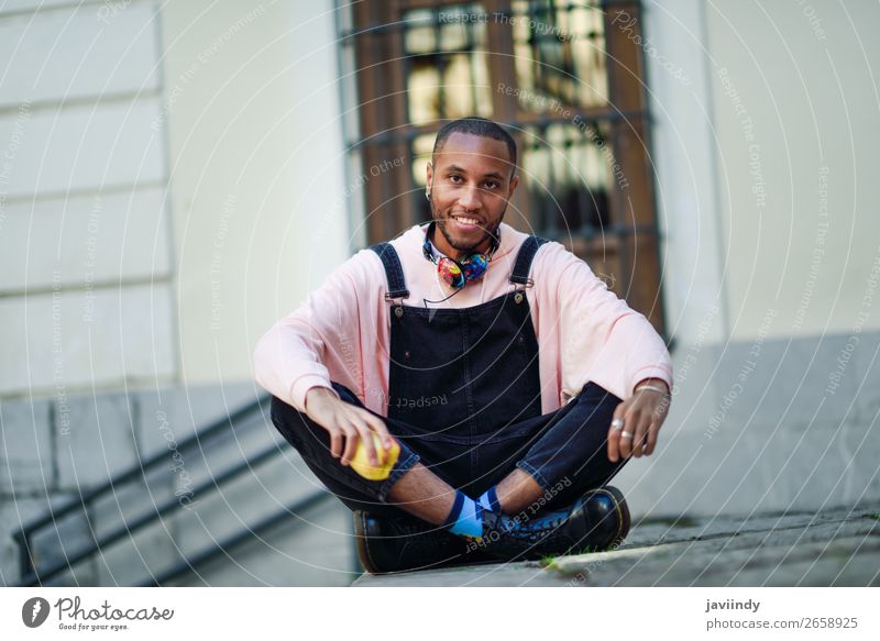 Young black man eating an apple sitting on urban steps Fruit Apple Eating Lifestyle Happy Beautiful Human being Masculine Young man Youth (Young adults) Man