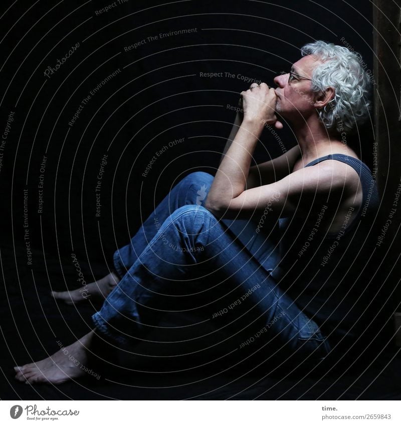 man in thoughts Attic Masculine Man Adults 1 Human being T-shirt Jeans Eyeglasses Barefoot Gray-haired Curl Observe Think To hold on Looking Sit Authentic Dark