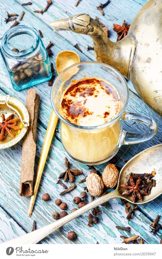 Masala tea with spices masala cup ingredient milk anise cinnamon drink ginger kettle beverage chai healthy indian stick glass warm organic spiced flavor