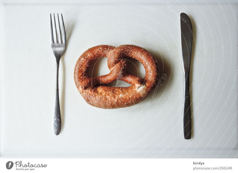 Pretzel with knife and fork on white background. Pretzel Nutrition Knives Fork Esthetic Simple Funny Brown Silver White 1 3 Cutlery German bakery products