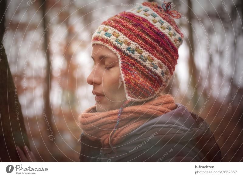 Woman with wool cap in front of tree Healthy Harmonious Relaxation Calm Meditation Winter Adults Face 1 Human being Autumn Tree Park Forest Clothing Coat Scarf