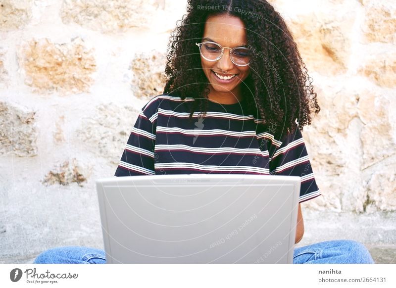 smiling young woman working with her laptop Lifestyle Style Happy Beautiful Hair and hairstyles Calm Education Adult Education Study Student Work and employment
