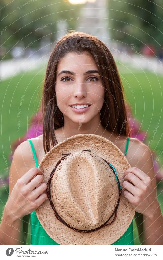 Portrait of a young happy woman in the park Lifestyle Happy Beautiful Vacation & Travel Tourism Summer Human being Woman Adults Nature Park Street Fashion Hat
