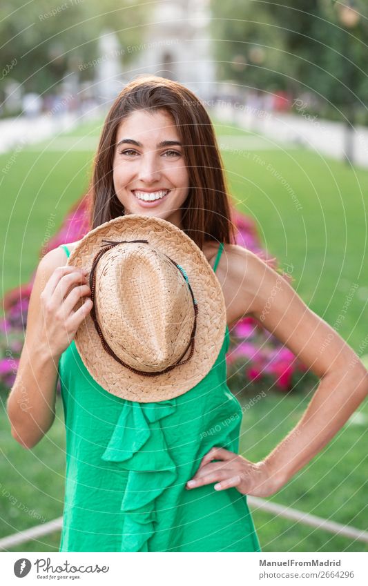 Portrait of a young happy woman in the park Lifestyle Happy Beautiful Vacation & Travel Tourism Summer Human being Woman Adults Nature Park Street Fashion Hat