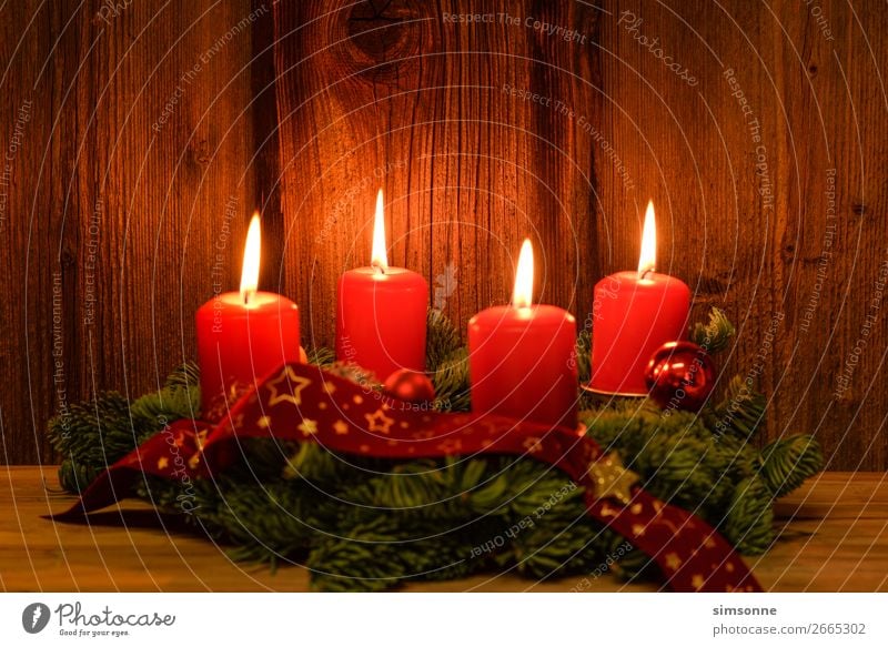 Christmas Advent wreath with 4 burning candles on old wood Decoration Christmas & Advent Candle Wood Flag Soft Red Moody Romance Christmas wreath Candlelight