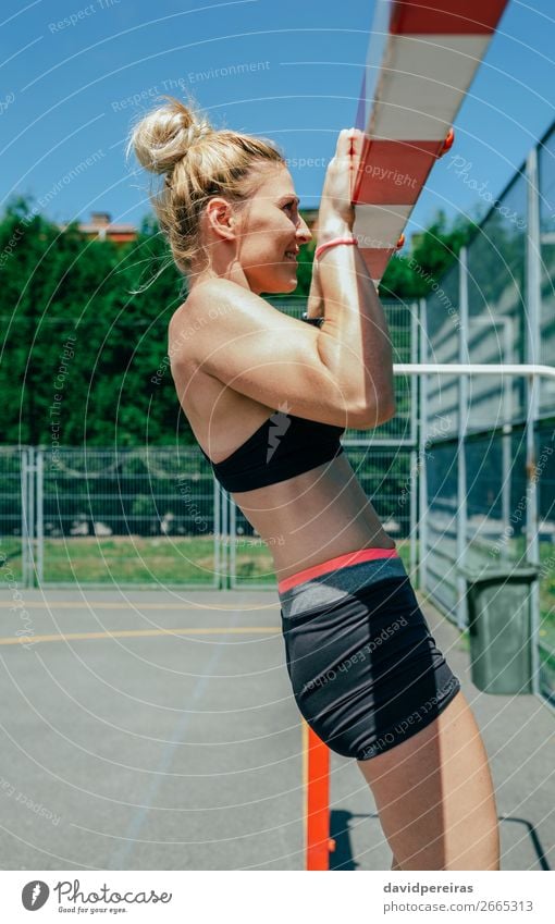 Female athlete doing pull-ups in a goal Lifestyle Beautiful Body Summer Sports Human being Woman Adults Blonde Fitness Athletic Authentic Thin Strong Power
