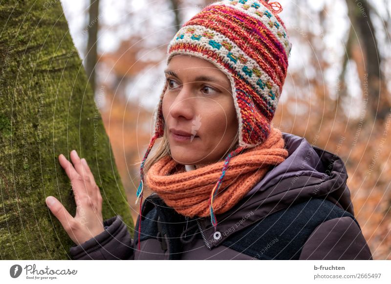 Woman with Peruvian cap Harmonious Contentment Hiking Adults Face Hand Autumn Tree Park Forest Coat Scarf Cap Observe Relaxation Looking Stand Simple Beautiful