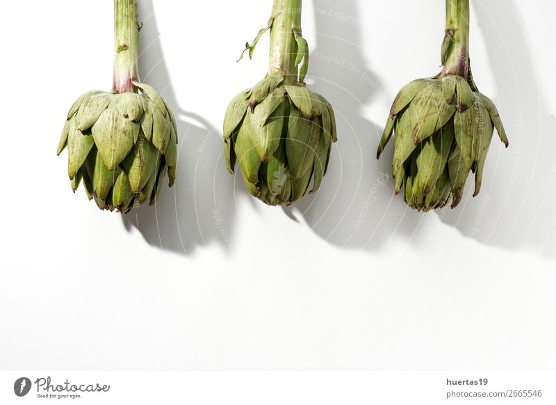 Fresh raw artichokes. On white background. Food Vegetable Nutrition Vegetarian diet Diet Healthy Eating Dark Delicious Natural Above Sour Green White Artichoke
