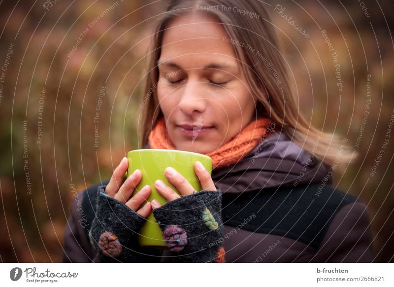 Woman with cup, outside Drinking Hot drink Coffee Tea Mulled wine Cup Mug Well-being Contentment Calm Adults Face Fingers 1 Human being Autumn Park Forest Coat