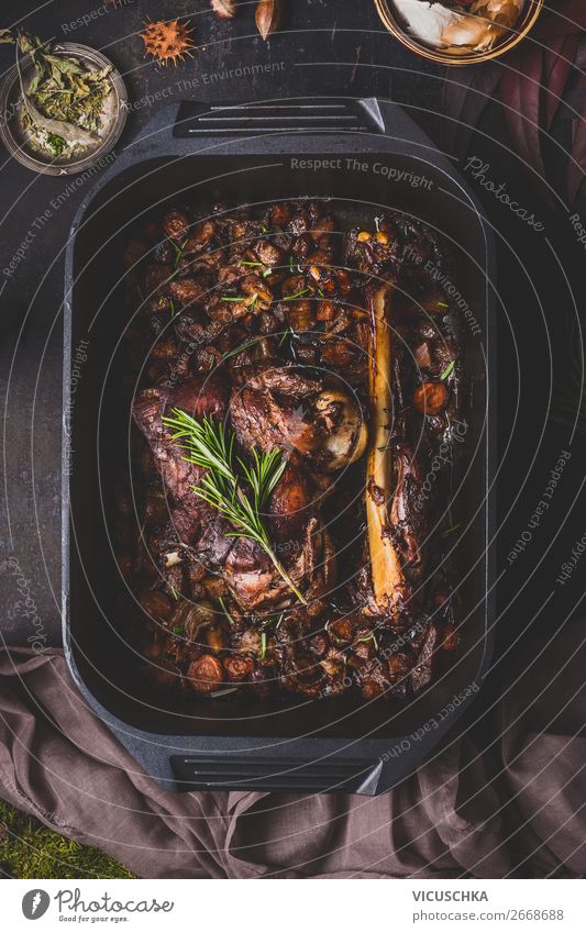 Slowly cooked roast venison in a cast iron pan Food Meat Herbs and spices Nutrition Dinner Banquet Organic produce Crockery Style Design Living or residing