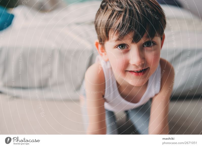 close up portrait of cute happy child boy Lifestyle Joy Happy Playing Freedom Bedroom Child Boy (child) Infancy Smiling Sleep Jump Authentic Small Cute Energy
