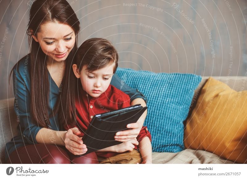 happy mother and toddler son using tablet Lifestyle Joy Relaxation Leisure and hobbies Playing Child School Computer Screen Technology Internet Boy (child)