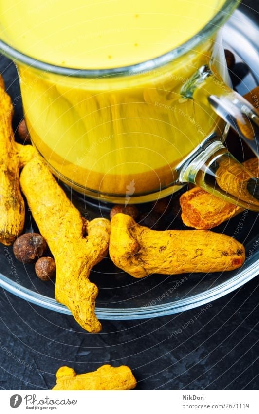 Healthy golden milk turmeric root medicine spice powder drink yellow remedy indian cinnamon healthy tea beverage detox herbal therapy curcumin cup glass ginger