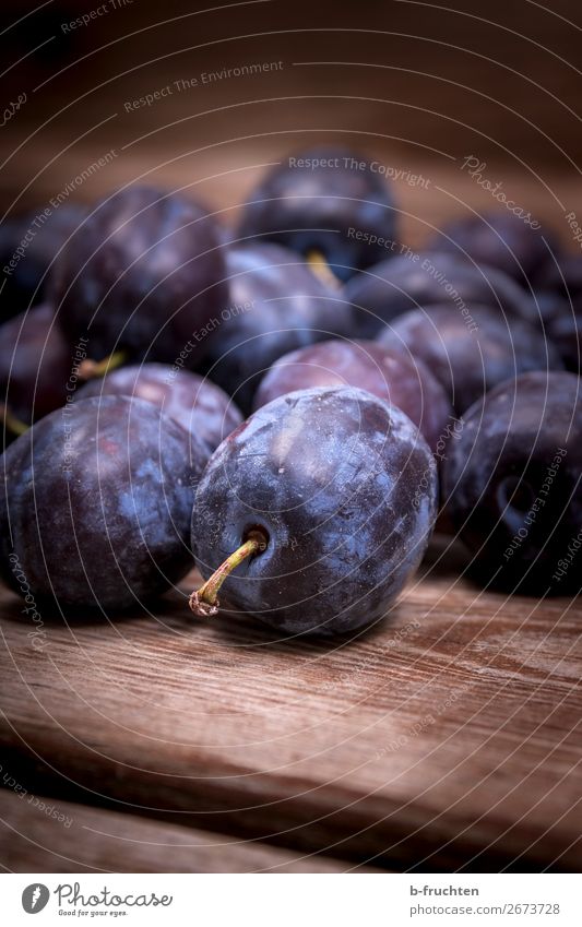 Damask plums Food Fruit Organic produce Vegetarian diet Healthy Eating Kitchen Autumn Select Fresh Blue Plum Stone fruit Many Wooden board Wooden table Vitamin