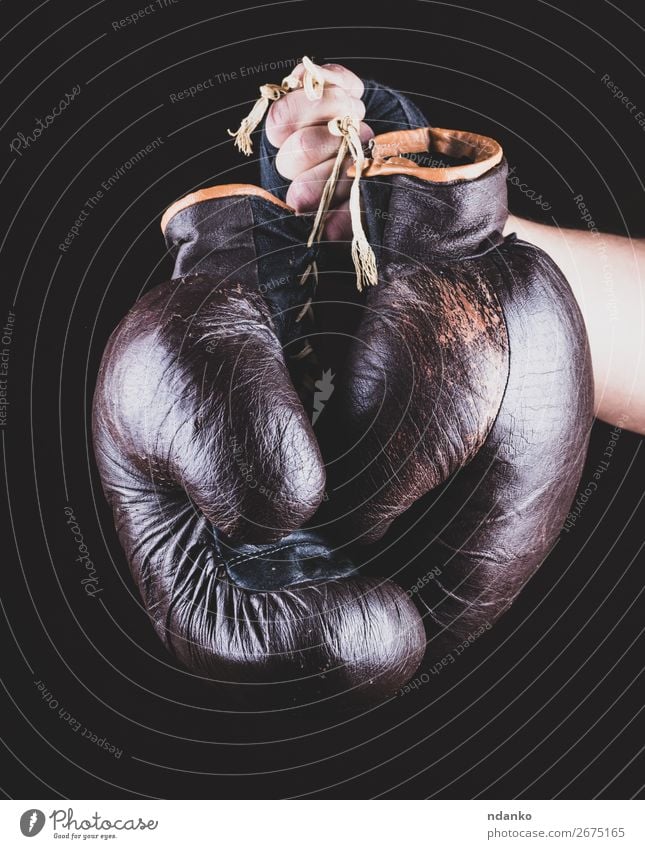 pair of leather sports boxing gloves in hand Sports Success Hand Leather Gloves Old Fitness Brown Black Power Protection Competition boxer Boxing equipment