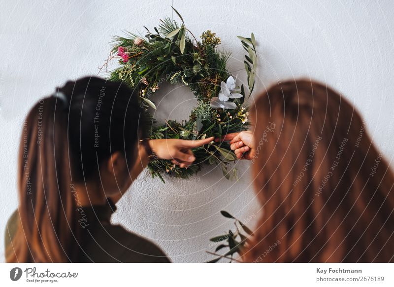 two woman are preparing christmas decorations Business Entrepreneur Flowers Plants Small Business Woman Working advent arrangement branch caucasian client