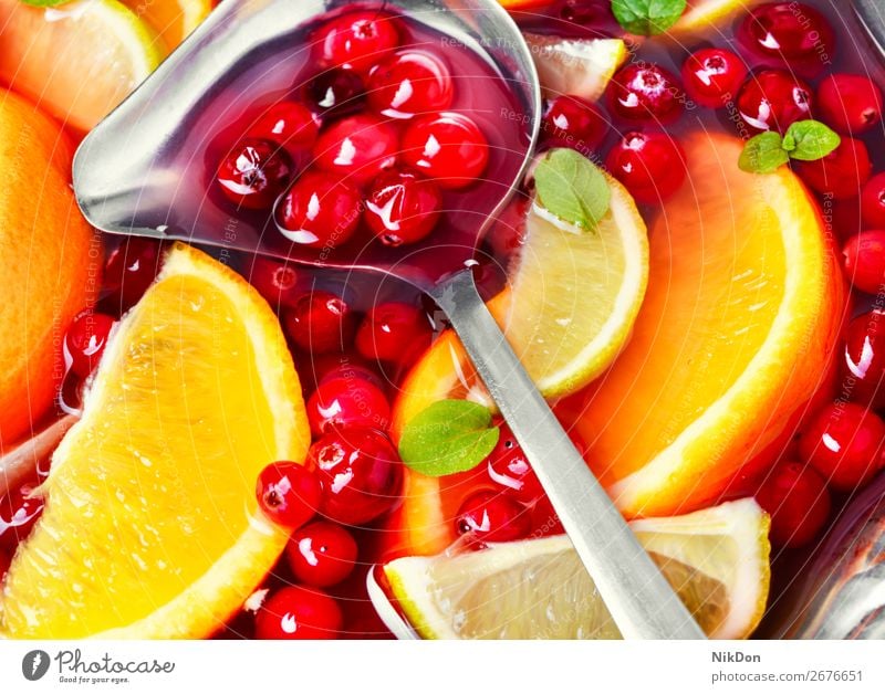 Cocktail with fruits and berries red drink punch background sangria cranberry beverage refreshment cocktail juice sweet alcohol orange wine citrus lemon closeup