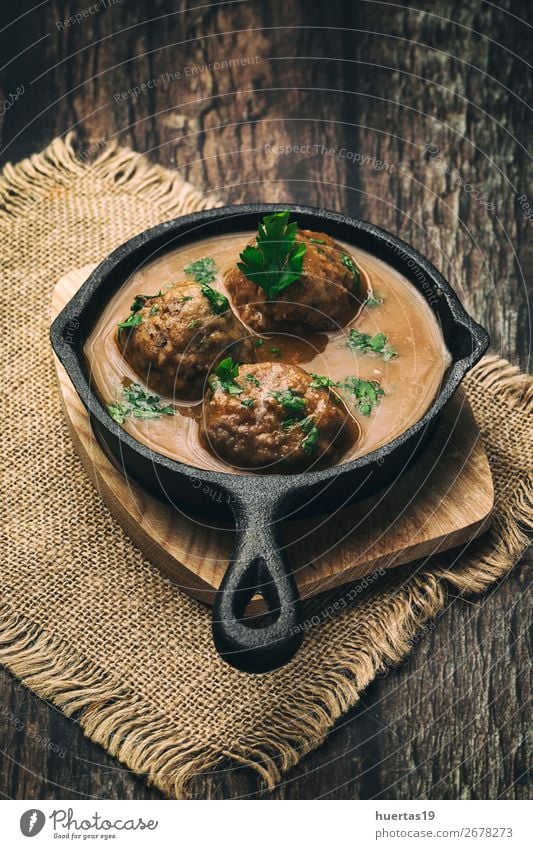 Homemade Albondigas with Spanish sauce Food Meat Sausage Herbs and spices Lunch Dinner Buffet Brunch Italian Food Crockery Plate Fork Art Delicious Above Brown