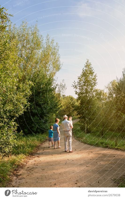 Grandparents and grandchildren walking outdoors Lifestyle Leisure and hobbies Summer Child Human being Baby Boy (child) Woman Adults Man Parents Grandfather