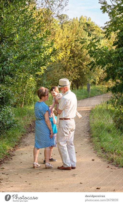 Grandparents and grandchildren walking outdoors Lifestyle Joy Happy Leisure and hobbies Summer Child Baby Boy (child) Woman Adults Man Parents Grandfather