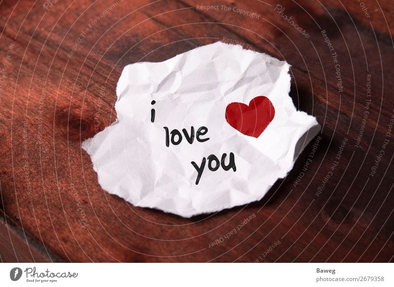 Note i love you on white paper shavings - a Royalty Free Stock