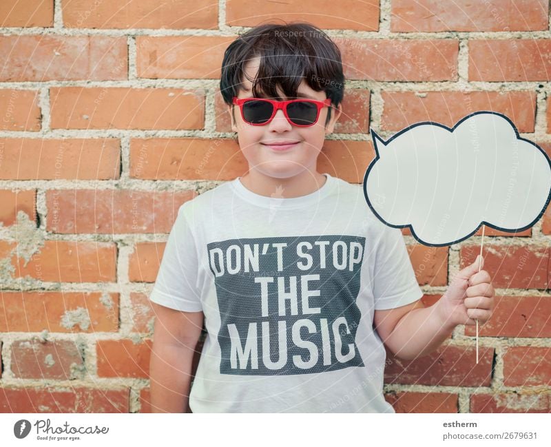 child with speech bubble and sunglasses in the street active advertisement announce background boy cheerful childhood cloud comic communicate communication