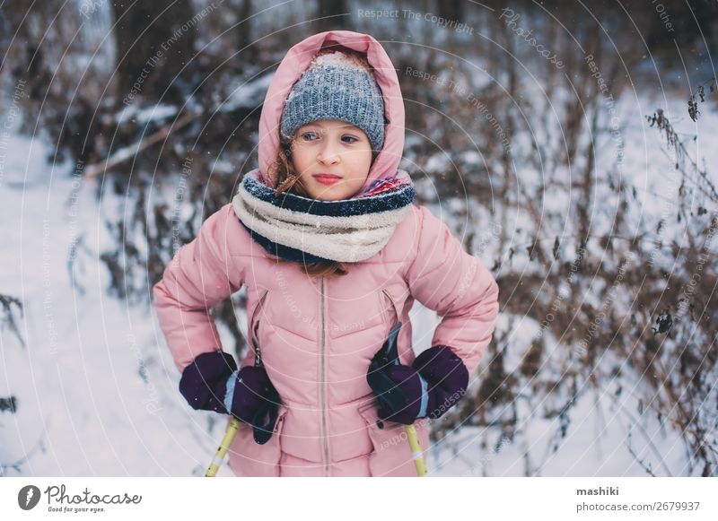 happy child girl skiing in winter snowy forest Joy Leisure and hobbies Vacation & Travel Adventure Winter Snow Sports Child Youth (Young adults) Landscape