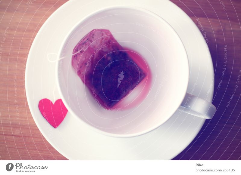 A cup of love. Beverage Drinking Hot drink Tea Crockery Cup Lifestyle Well-being Table Heart Relaxation Kitsch Delicious Red Spring fever Love Infatuation